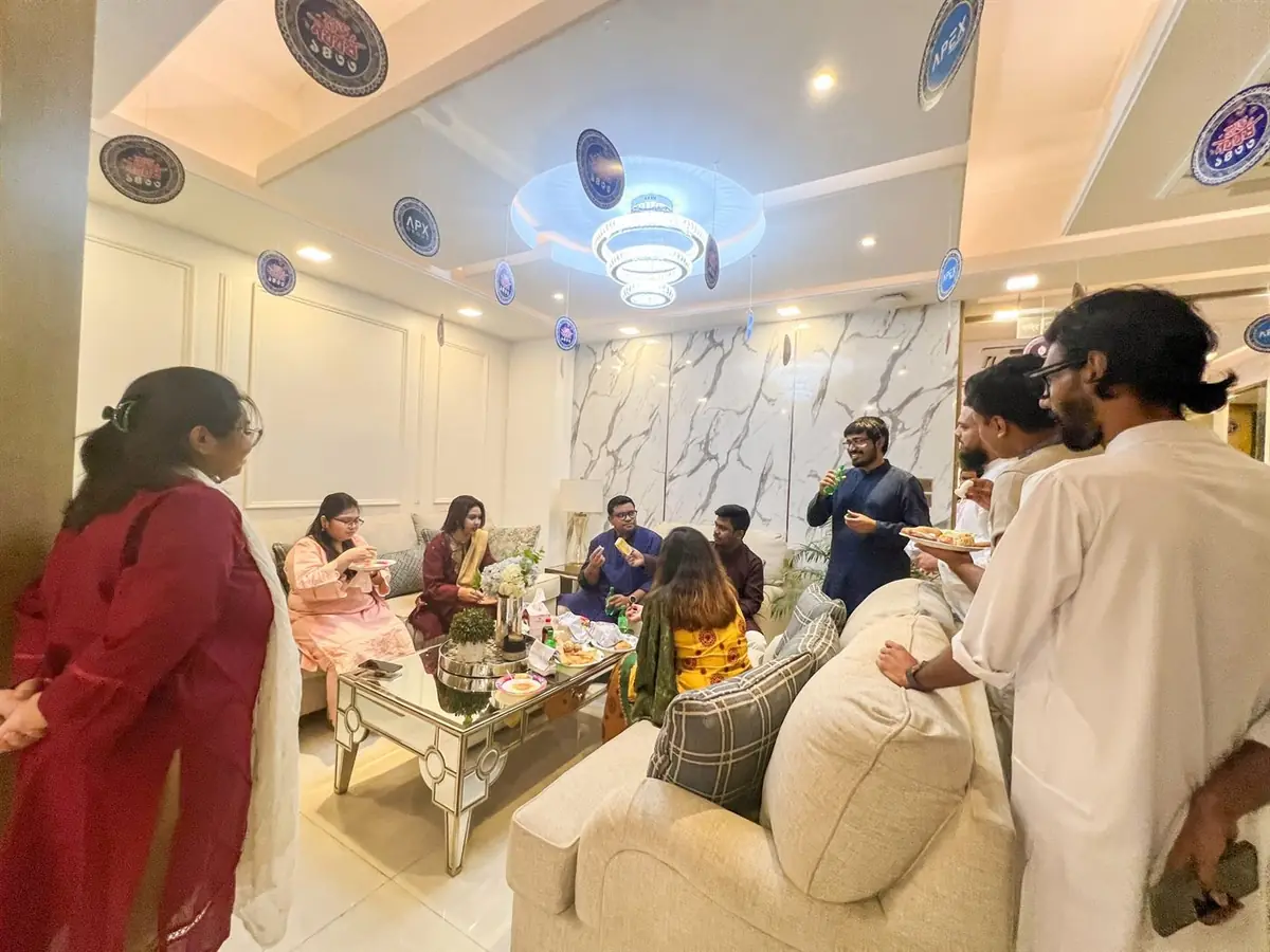 Colleagues sharing a meal together in the office lounge